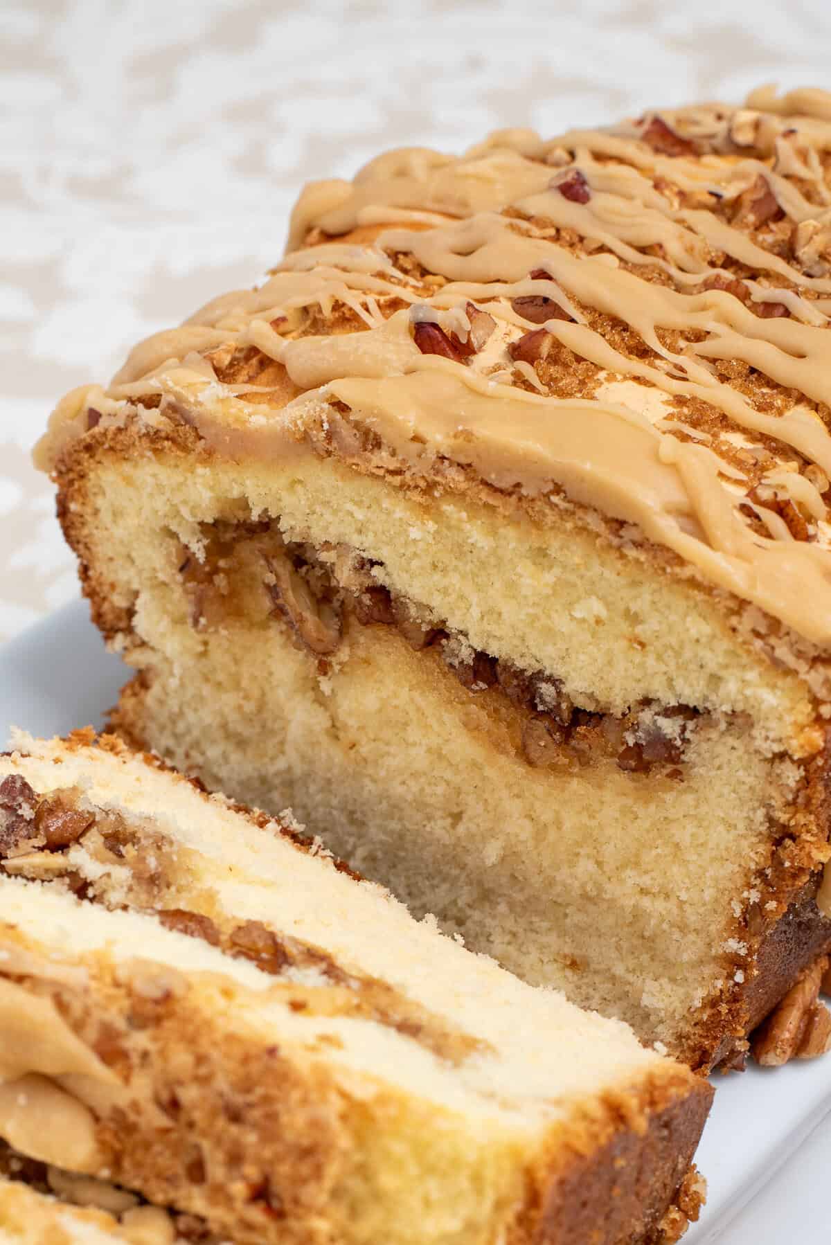 close up shot of butter pecan pound cake sliced.