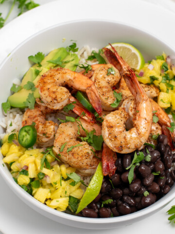 Blackened shrimp bowls with black beans, pineapple salsa, and avocado