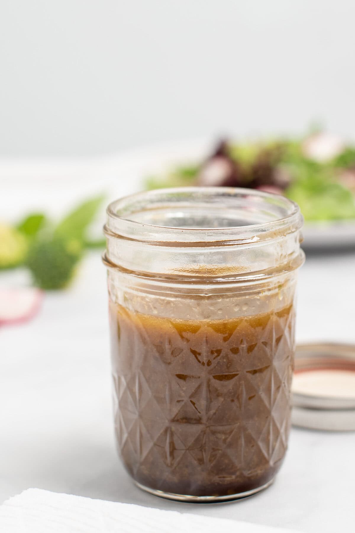 open jar of balsamic basil vinaigrette.