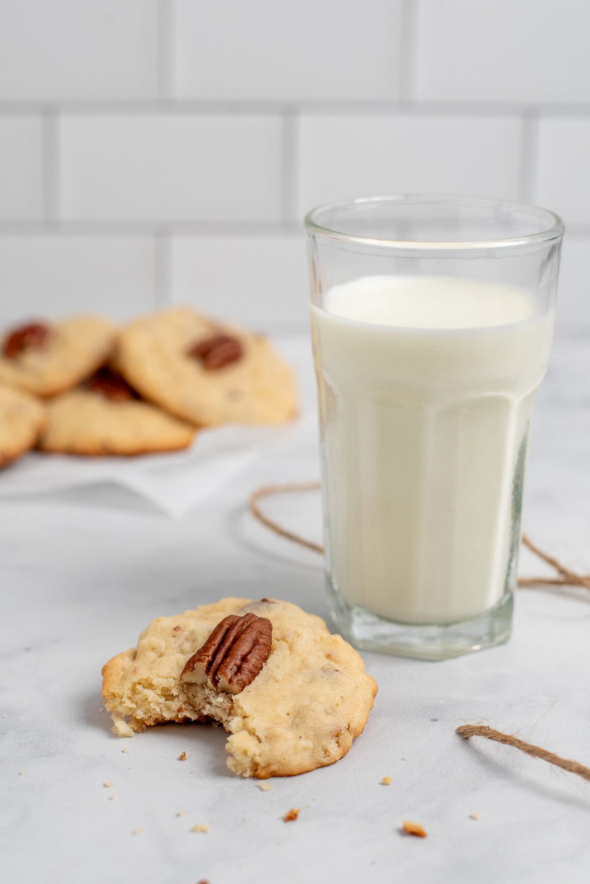 coconut pecan cookie with a bite out.