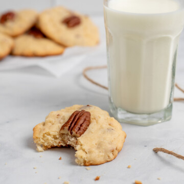square image of coconut pecan cookies with bite out.