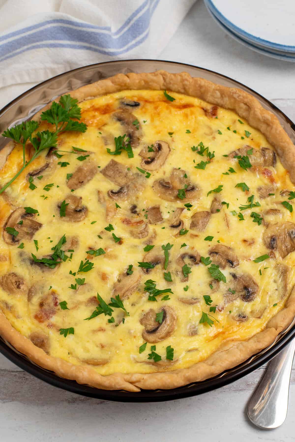 mushroom and bacon quiche with caramelized onions. 