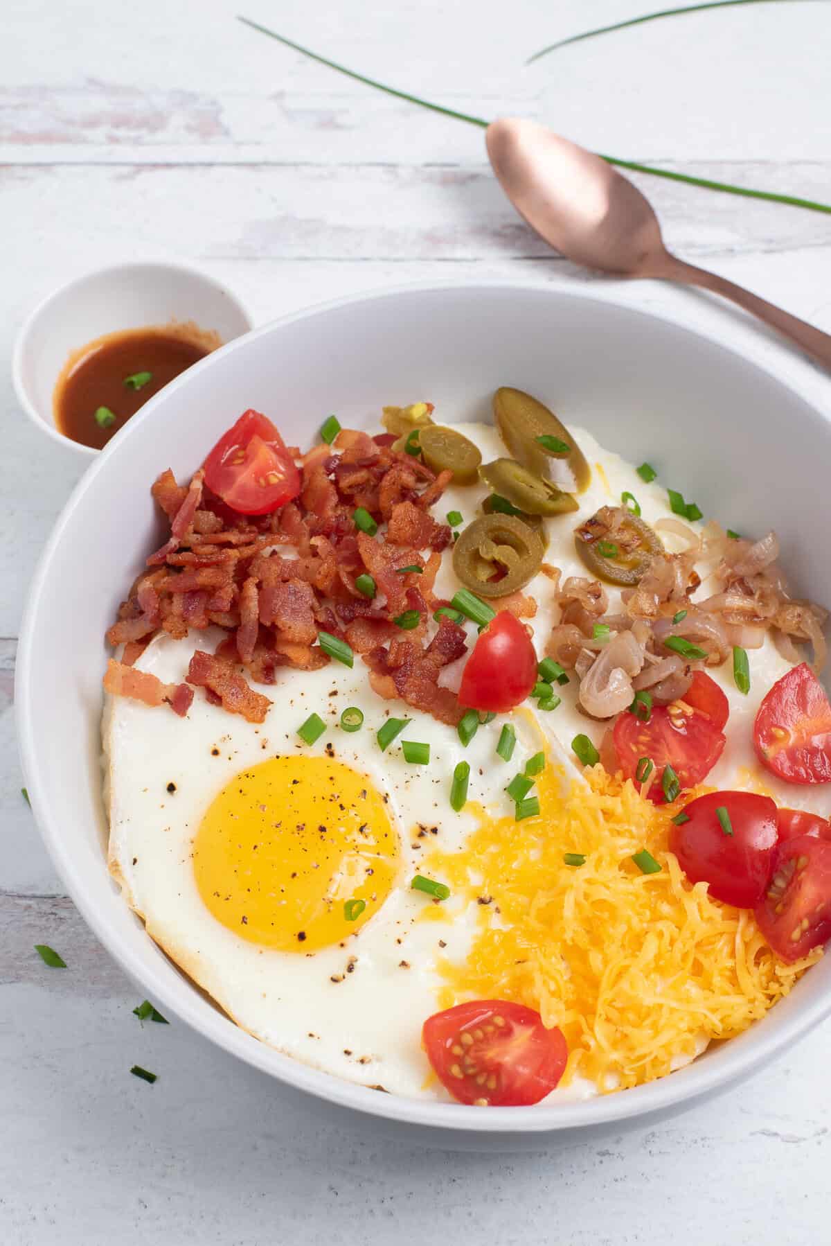 cheesy grits bowls with spoon. 