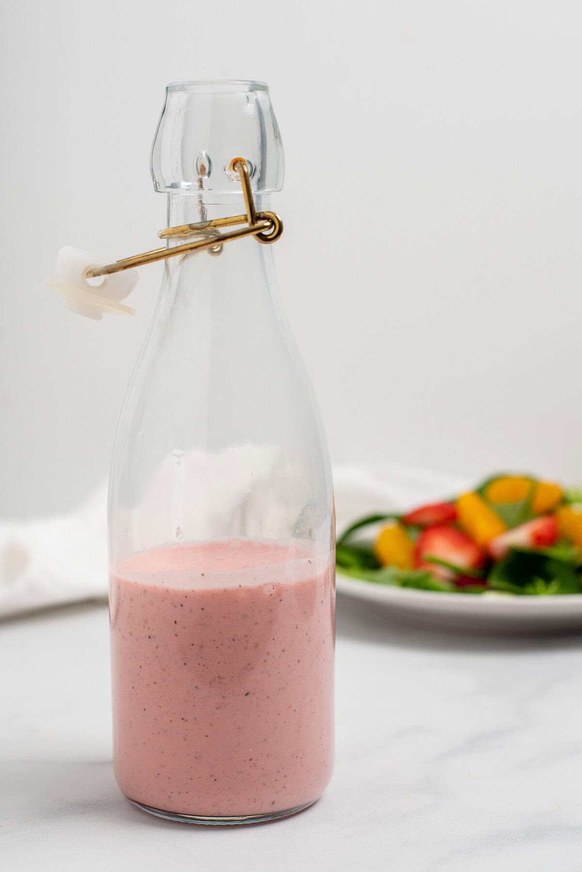 strawberry salad dressing in serving cruet.