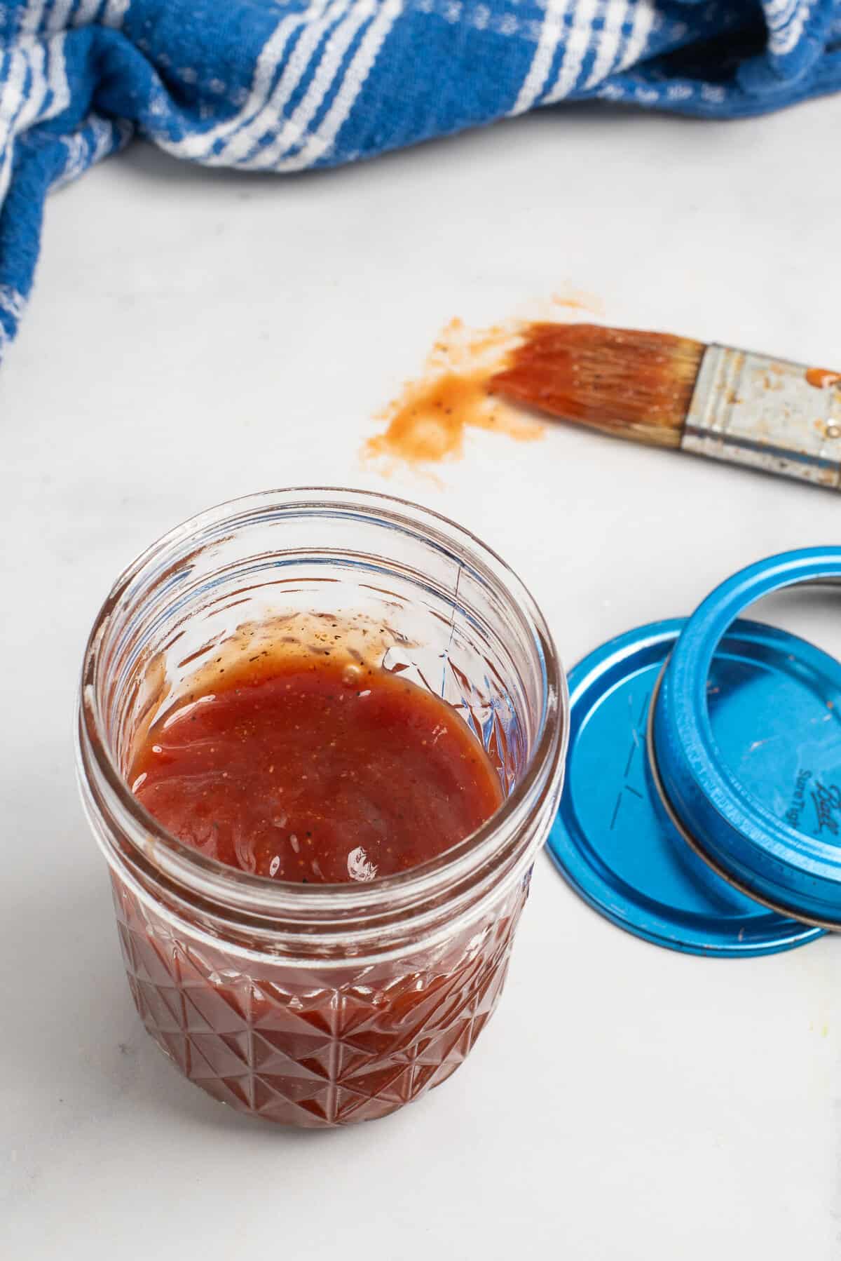 honey bbq sauce in jar with brush. 