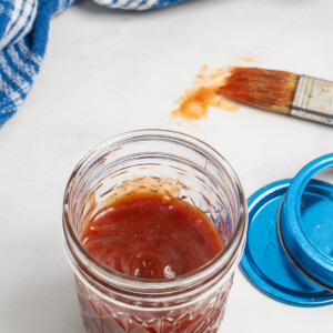 overhead of honey bbq sauce in jar.