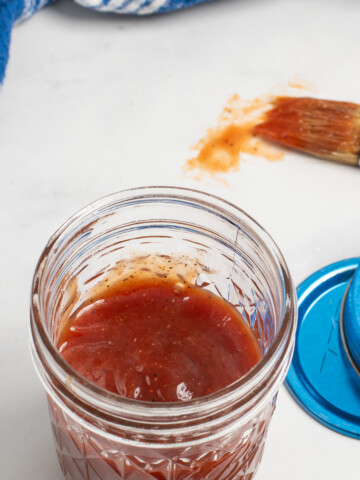 overhead of honey bbq sauce in jar.
