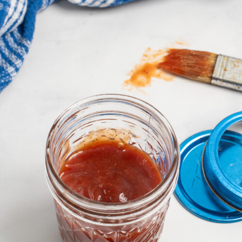 overhead of honey bbq sauce in jar.