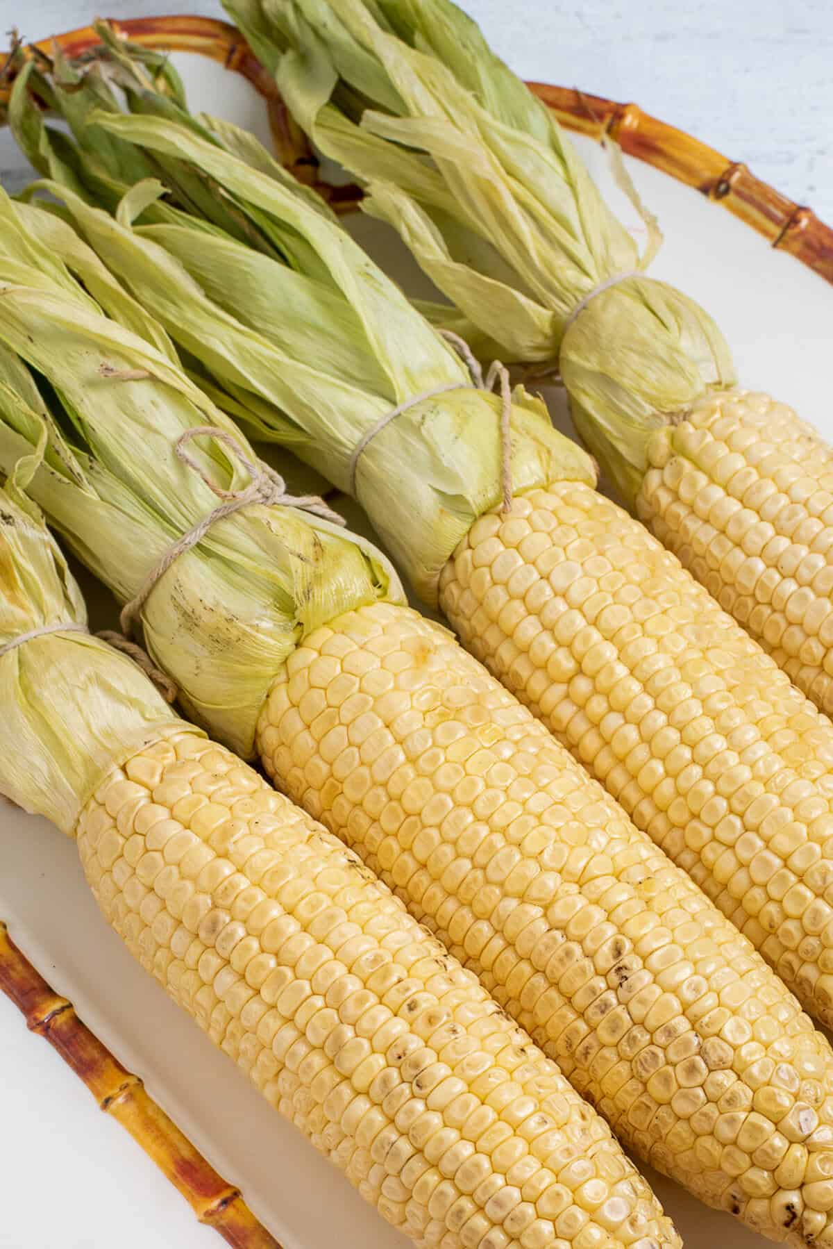 smoked corn on the cob on platter.