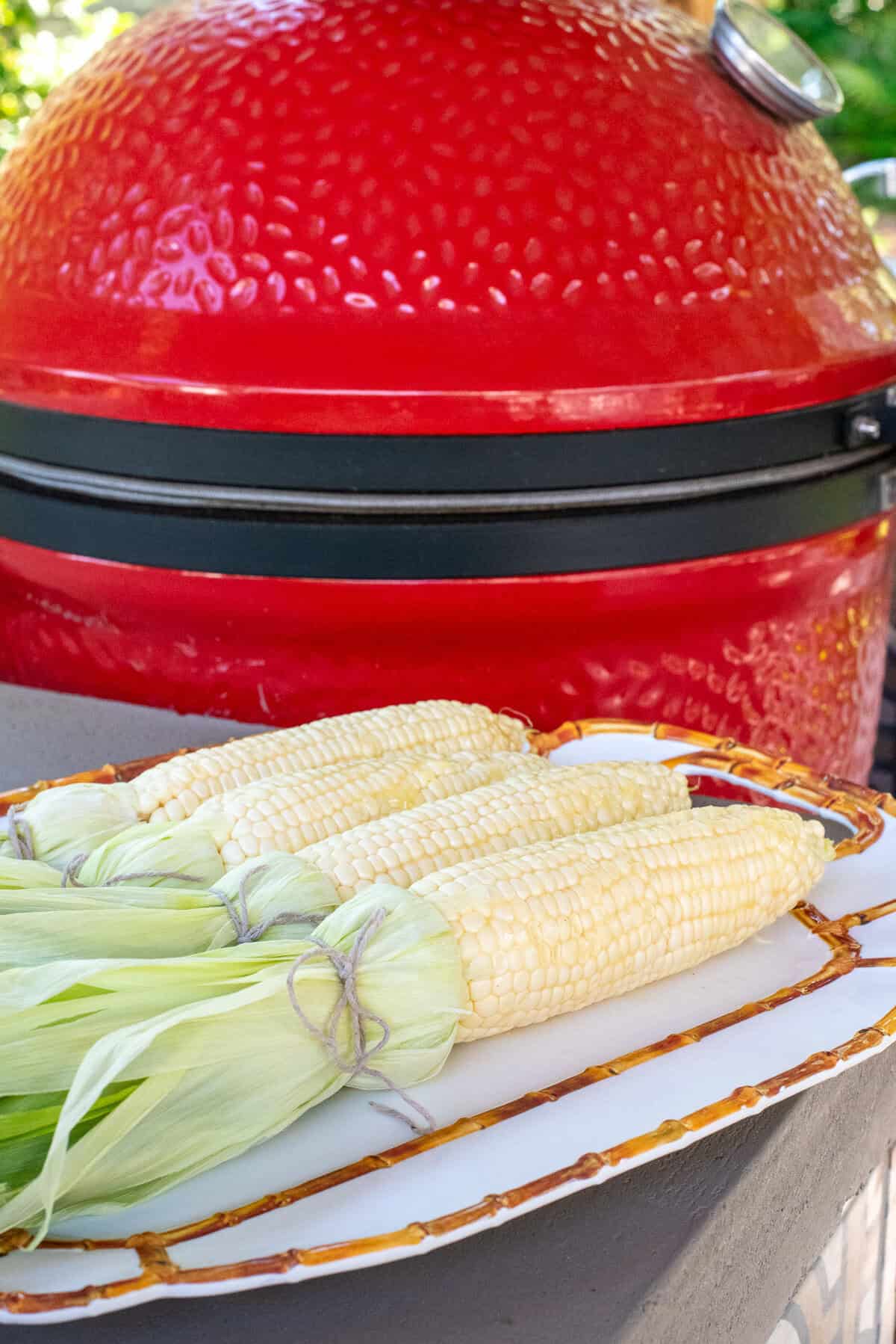 corn on the cob ready to go on smoker.