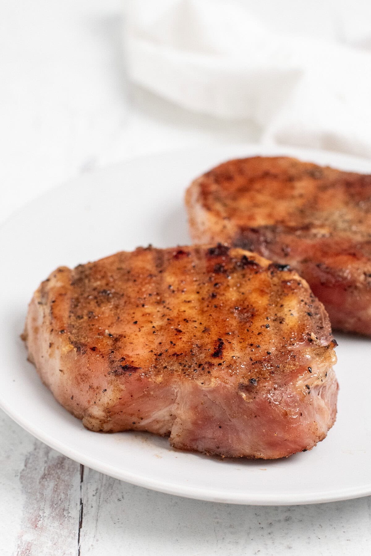 smoked pork chops on plate.