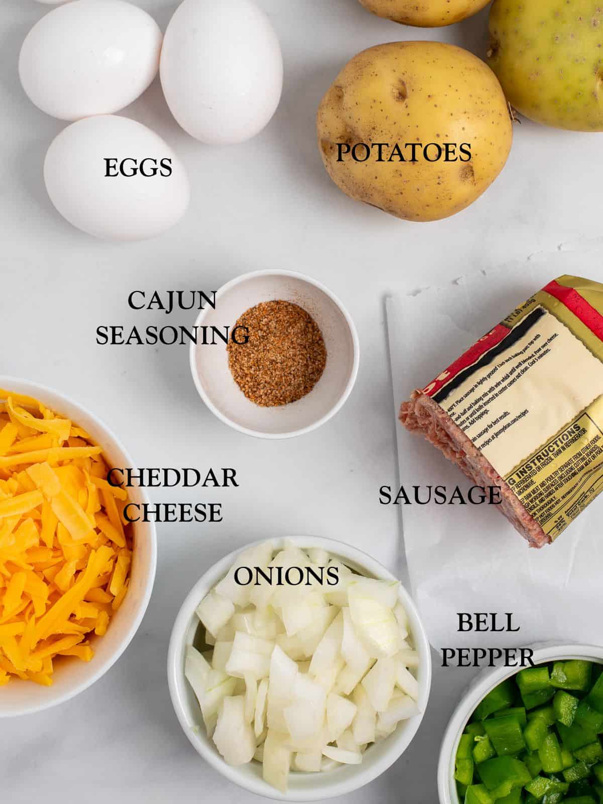 The ingredients needed to make this sausage breakfast skillet with the ingredient names in a text overlay.