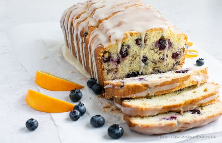 A load of blueberry orange bread with 3 sliced cut off the end.