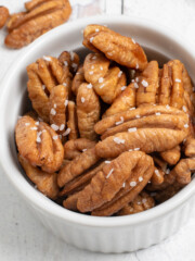 square image of honey roasted pecans in bowl.